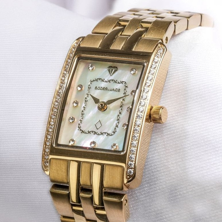 Produktbild- guld klocka vit bakgrund