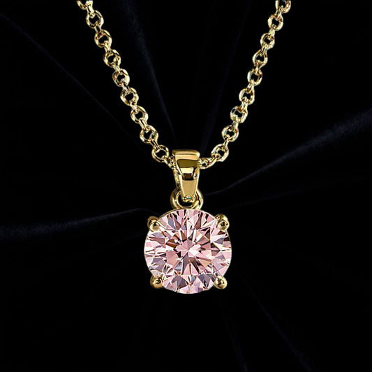 Guld halsband med rund rosa sten på svart sammetstyg i bakgrunden